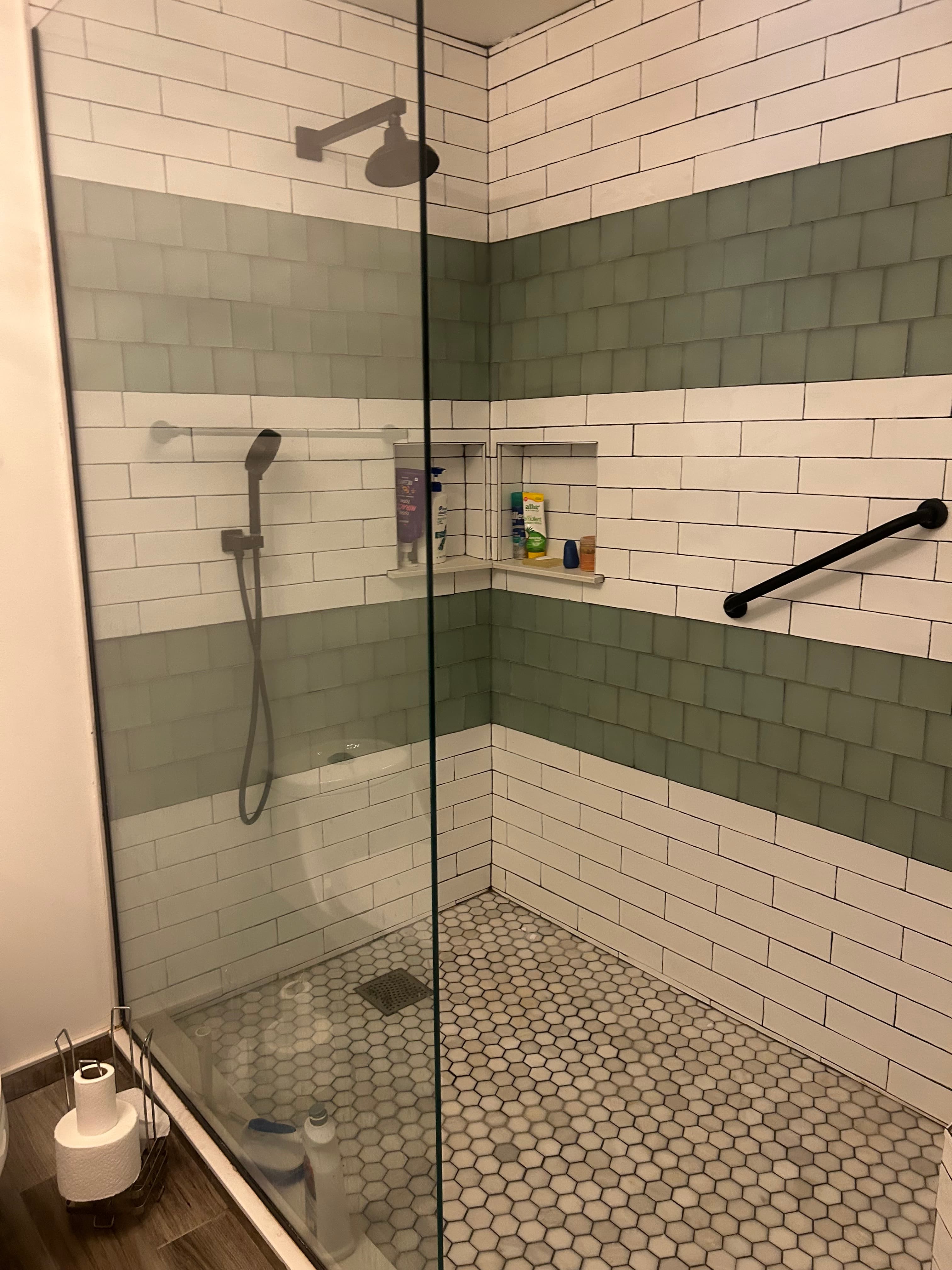 Primary walk-in shower — glass door, subway and hex tile